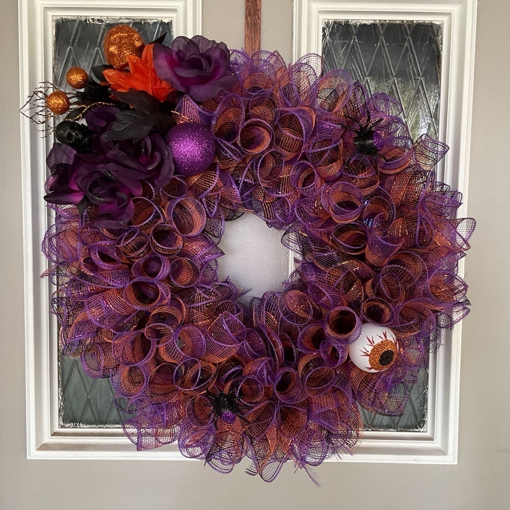 HALLOWEEN WREATH WITH PURPLE AND ORANGE ADORNED WITH FLOWERS AND SKULL HAND MADE